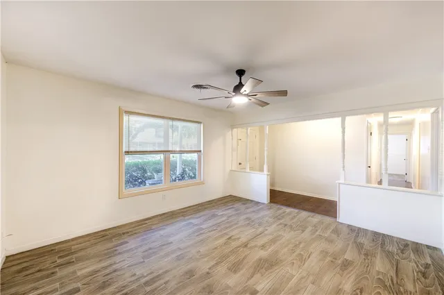 a view of an empty room with a window