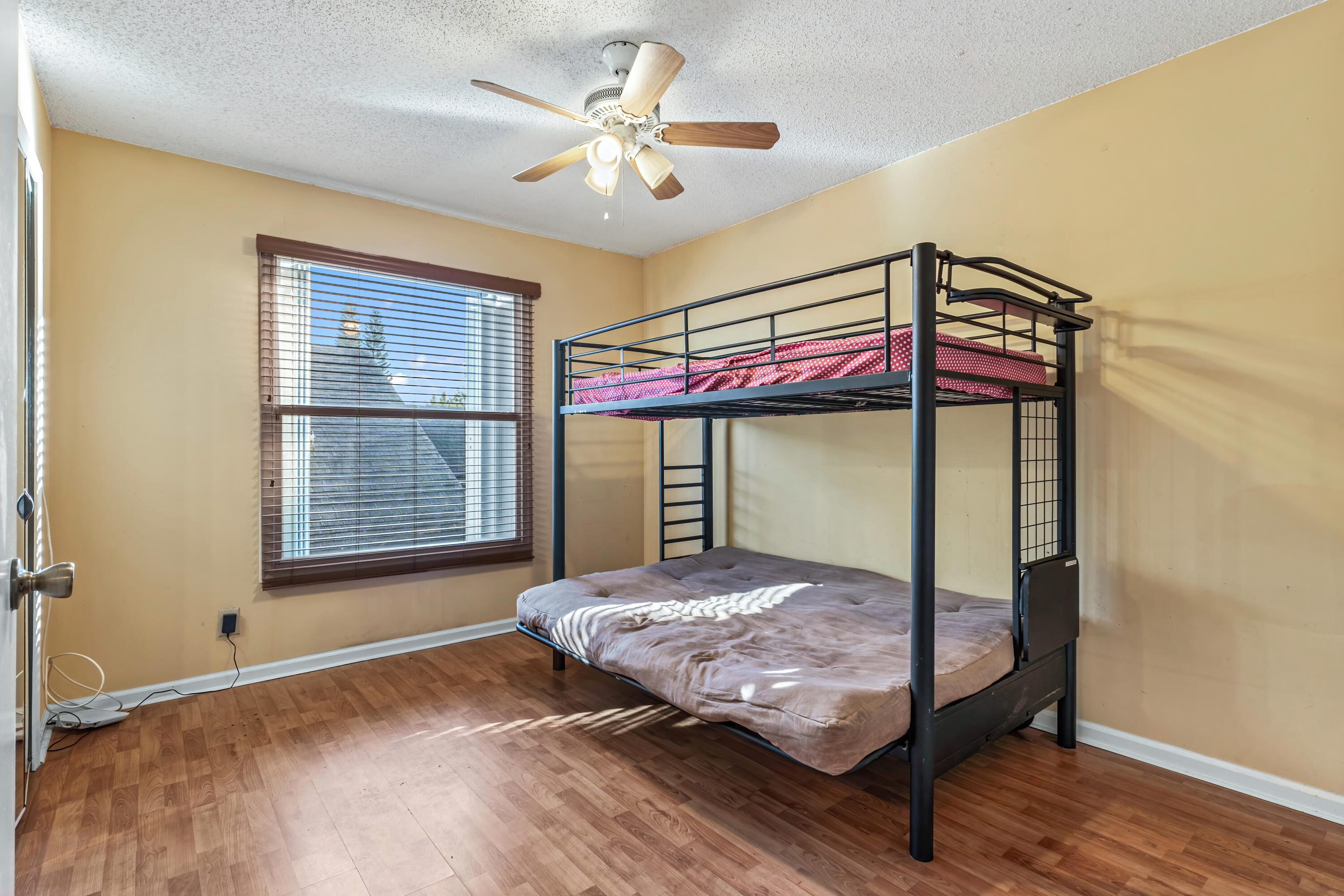 2224 Soundings Court Greenacres, FL 33413 - Photo 14 of 46 a bedroom with a bed and a window