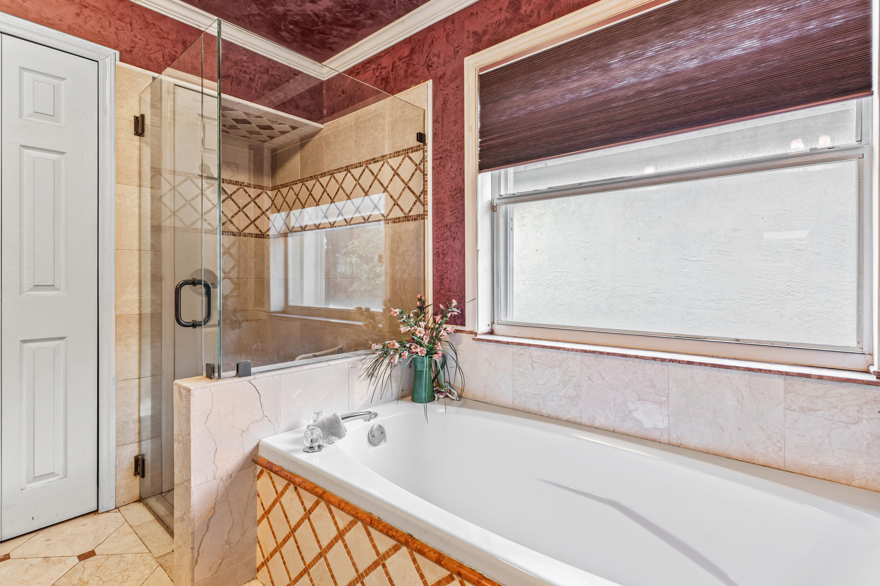 2224 Soundings Court Greenacres, FL 33413 - Photo 18 of 46 a bathroom with a tub a sink and a mirror