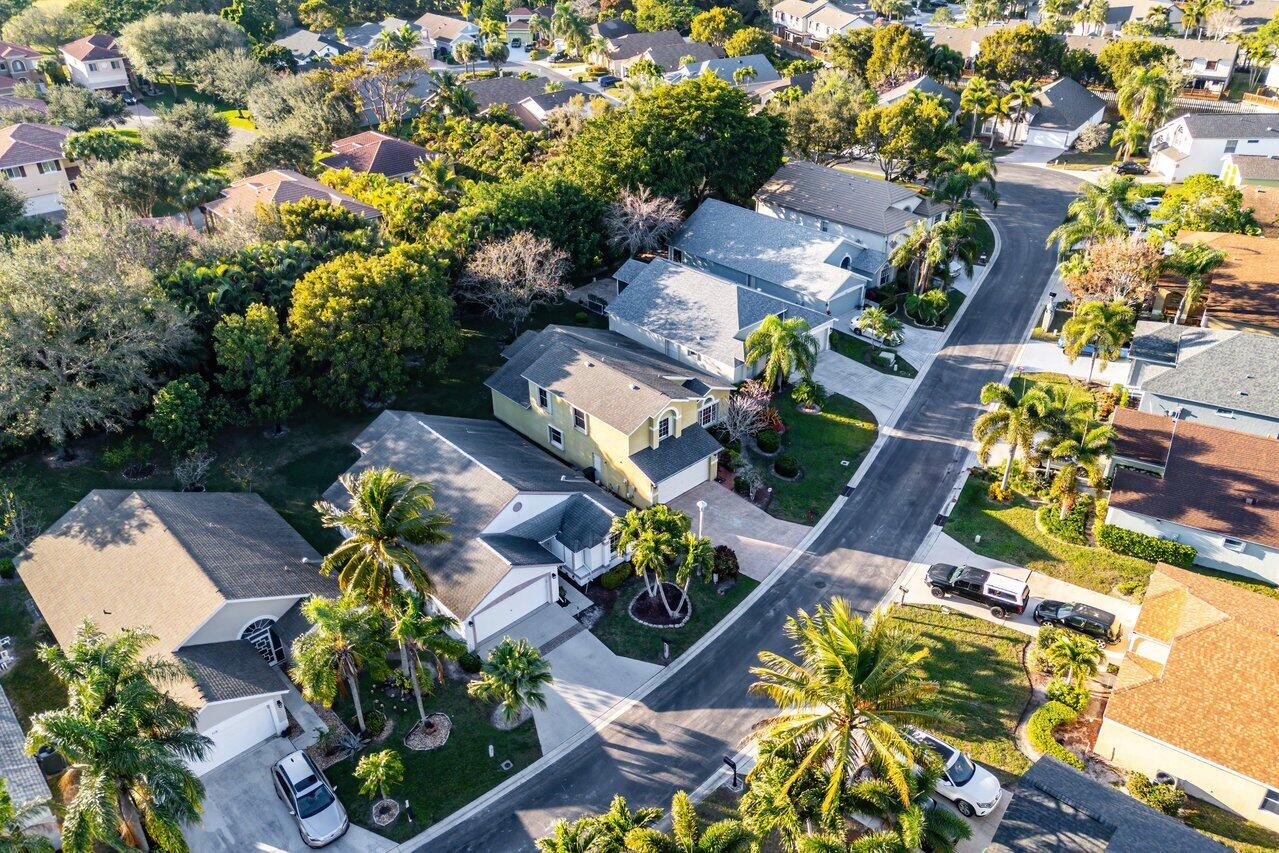 2224 Soundings Court Greenacres, FL 33413 - Photo 31 of 46 an aerial view of residential house with outdoor space and swimming pool
