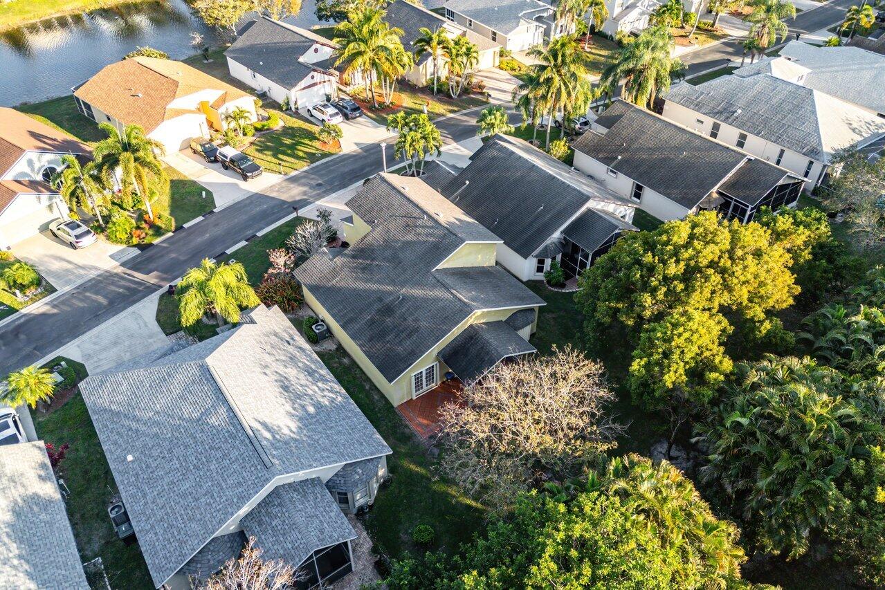 2224 Soundings Court Greenacres, FL 33413 - Photo 33 of 46 an aerial view of a house with a swimming pool