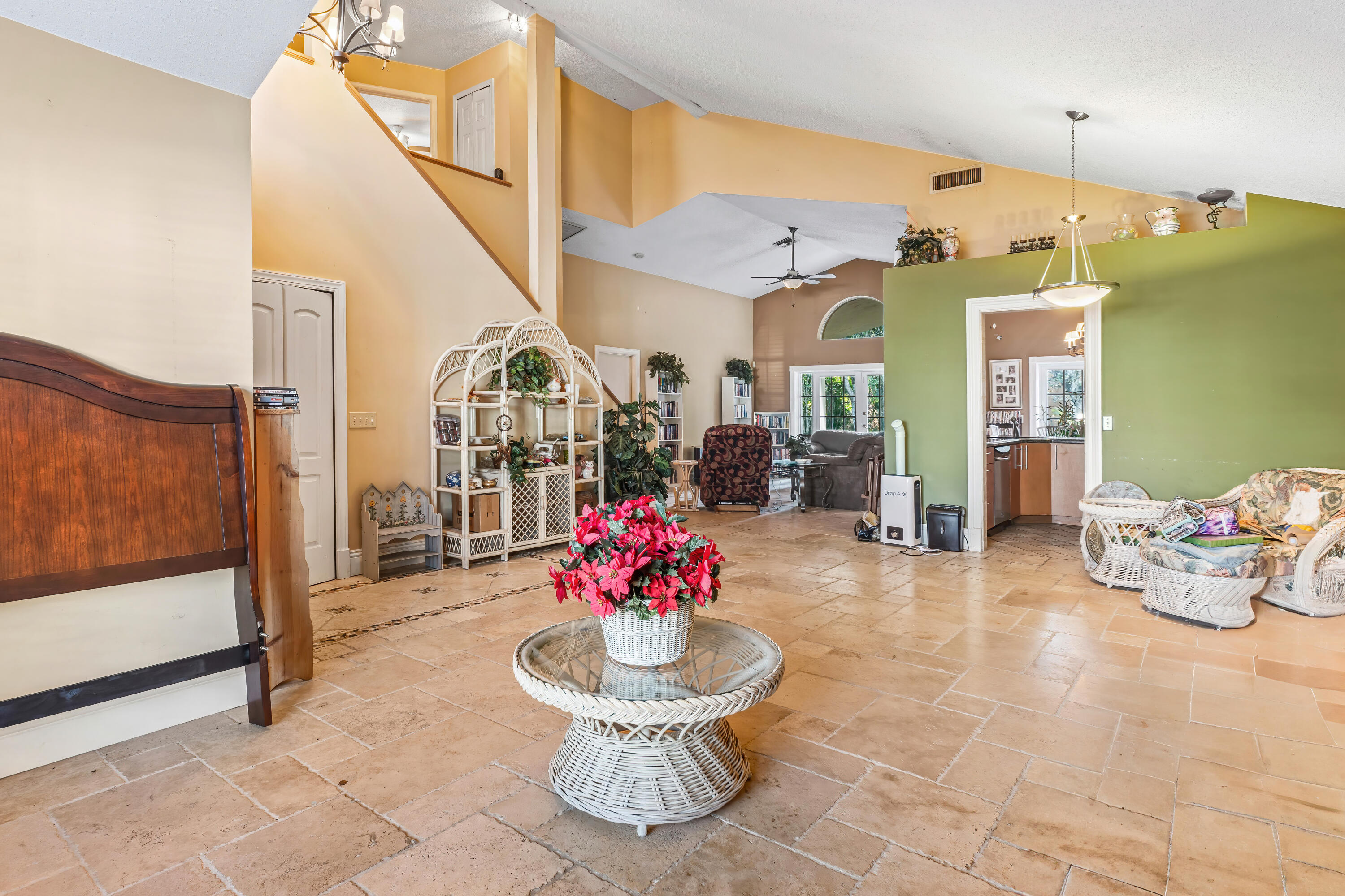 2224 Soundings Court Greenacres, FL 33413 - Photo 5 of 46 a lobby with furniture and a potted plant