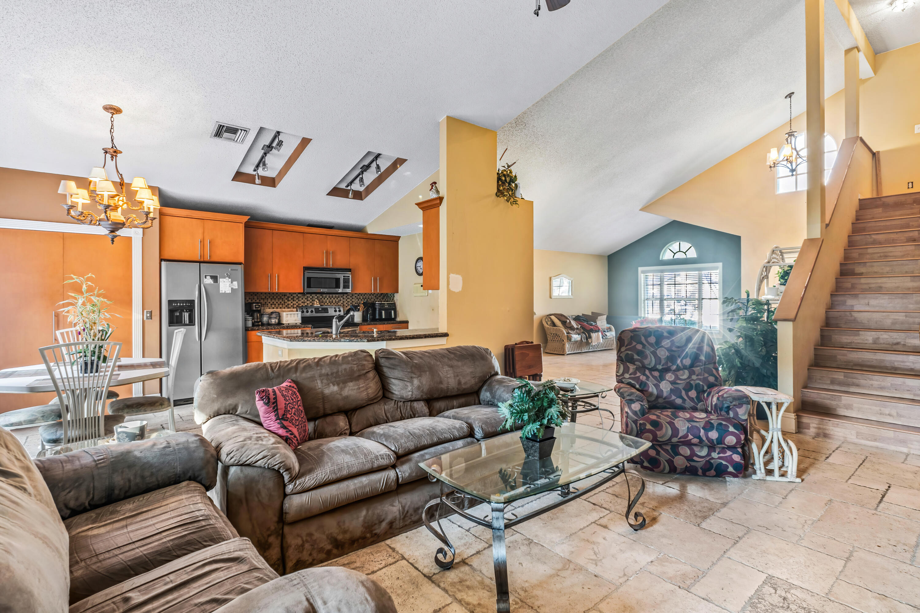 2224 Soundings Court Greenacres, FL 33413 - Photo 8 of 46 a living room with furniture flowerpot and a chandelier