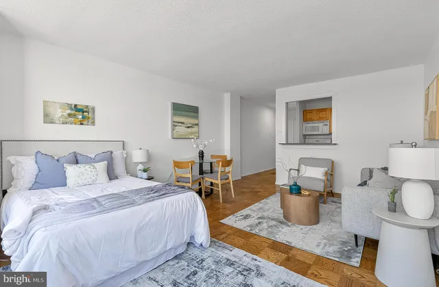 a bedroom with a bed and a table in it