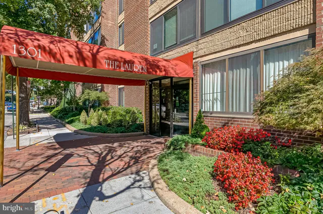 a view of a house with potted plants