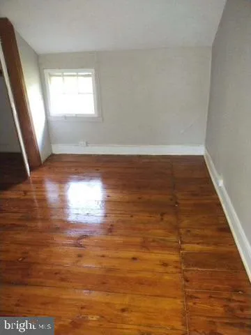a view of room and hardwood floor