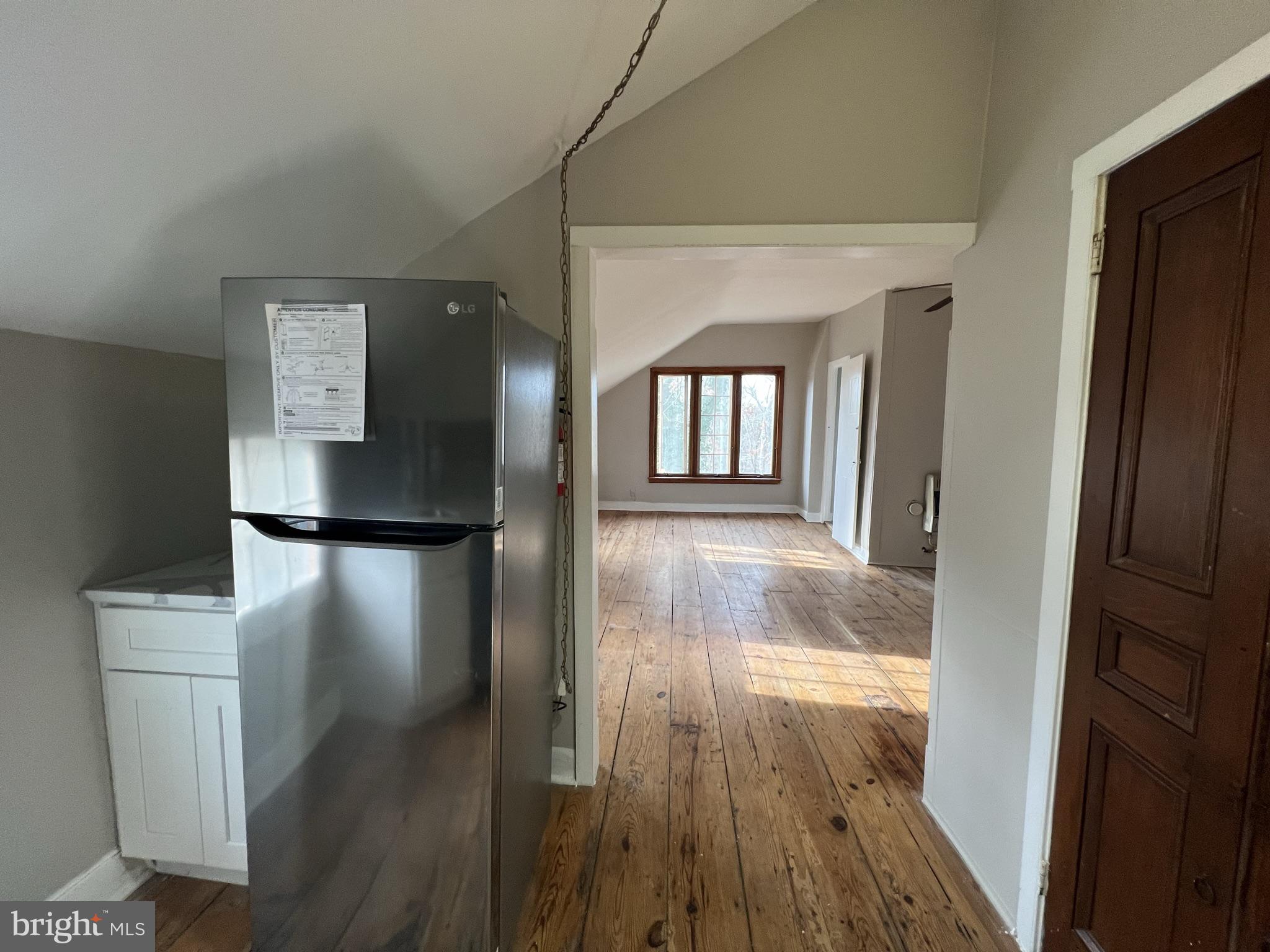 1 Breakneck Road, Unit 6 Medford, NJ 08055 - Photo 5 of 20 a view of a hallway with wooden floor and a living room