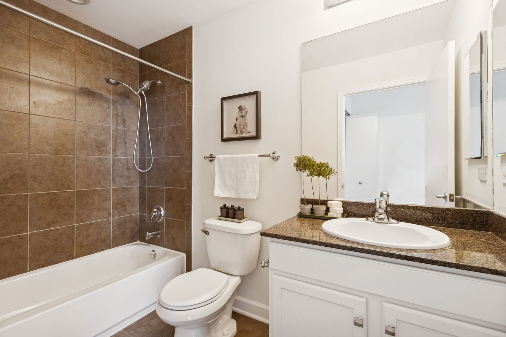 1901 South Calumet Avenue, Unit 1803 Chicago, IL 60616 - Photo 15 of 20 a bathroom with a sink toilet a mirror and shower