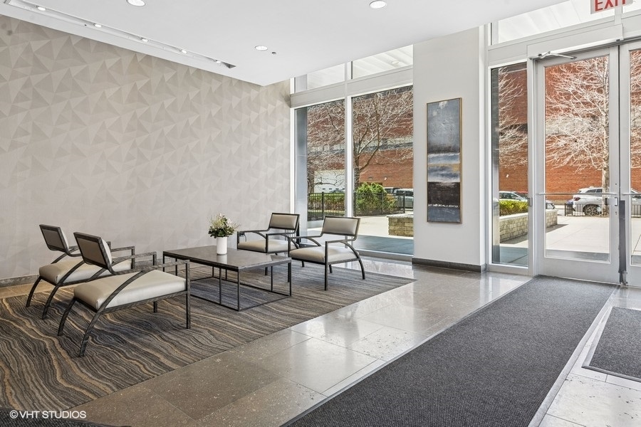 1901 South Calumet Avenue, Unit 1803 Chicago, IL 60616 - Photo 16 of 20 a living room with furniture and a large window