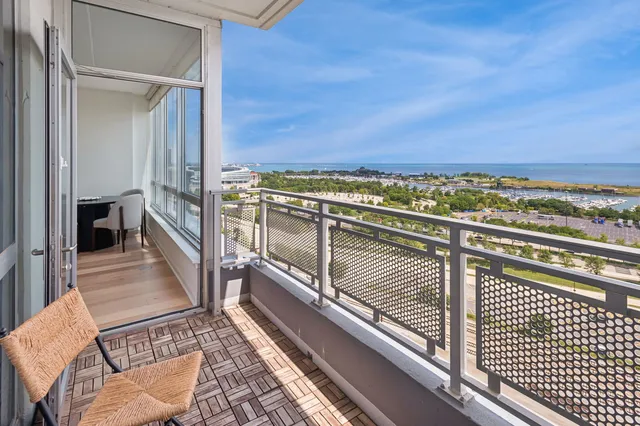 a kitchen with stainless steel appliances a refrigerator and wooden floor