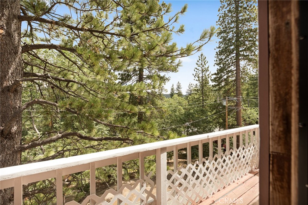 33159 Ridge Drive Running Springs, CA 92382 - Photo 22 of 24 a view of a balcony with wooden fence