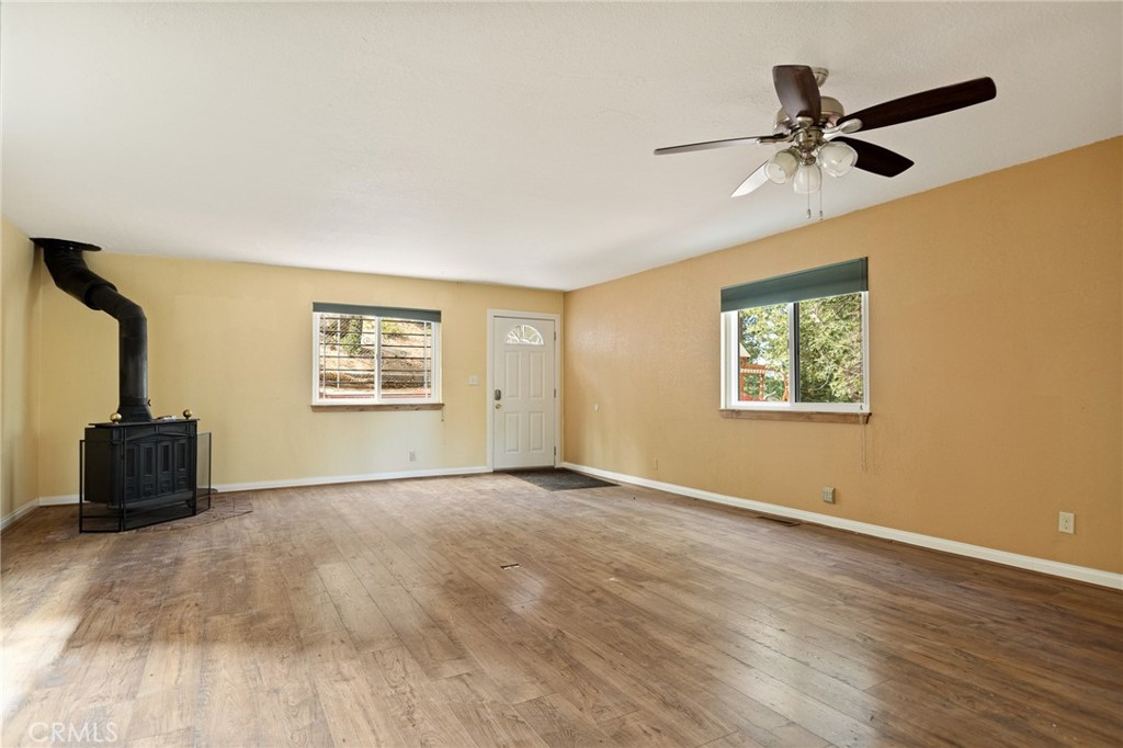 33159 Ridge Drive Running Springs, CA 92382 - Photo 4 of 24 a view of an empty room with a window