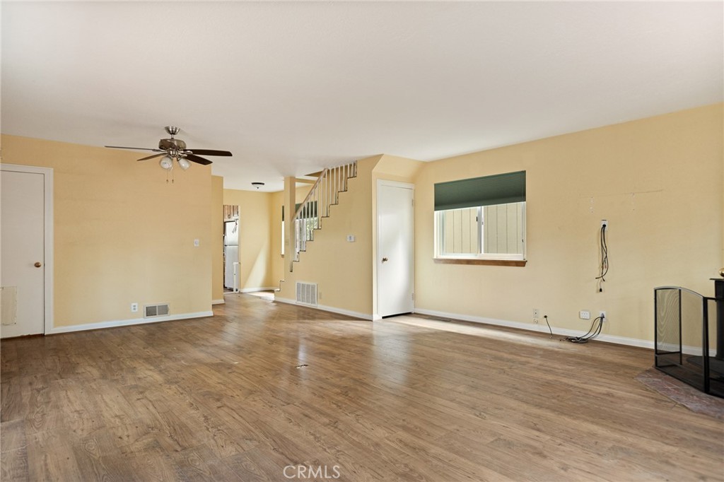 33159 Ridge Drive Running Springs, CA 92382 - Photo 6 of 24 a view of a room with wooden floor and a ceiling fan