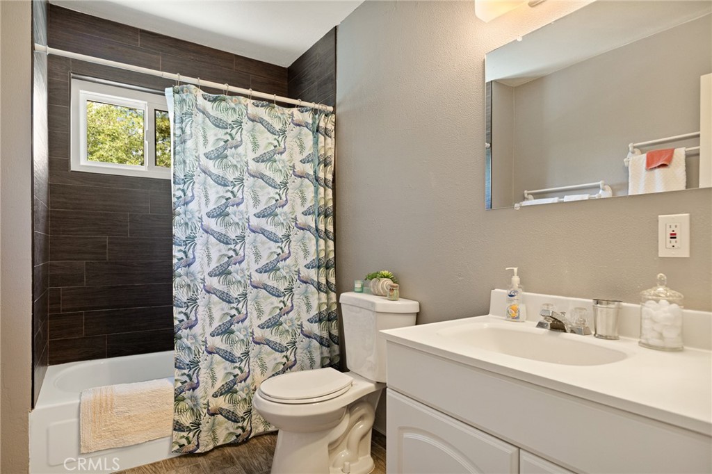 33159 Ridge Drive Running Springs, CA 92382 - Photo 10 of 24 a bathroom with a sink and a toilet