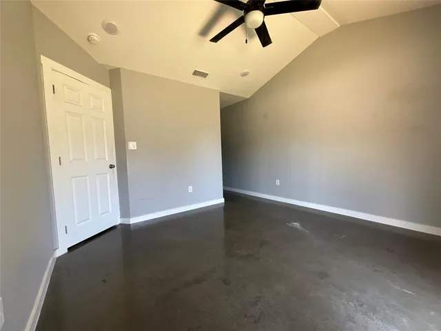 an empty room with a empty space and windows