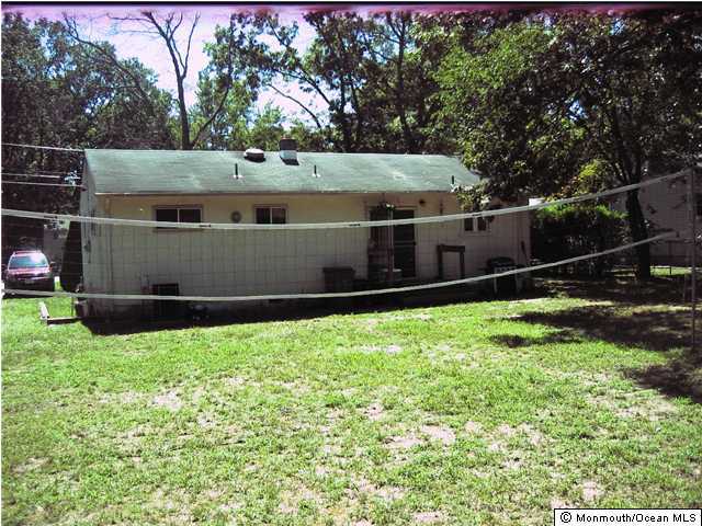 31 Lucy Road Lakewood, NJ 08701 - Photo 2 of 2 a view of a backyard with fence