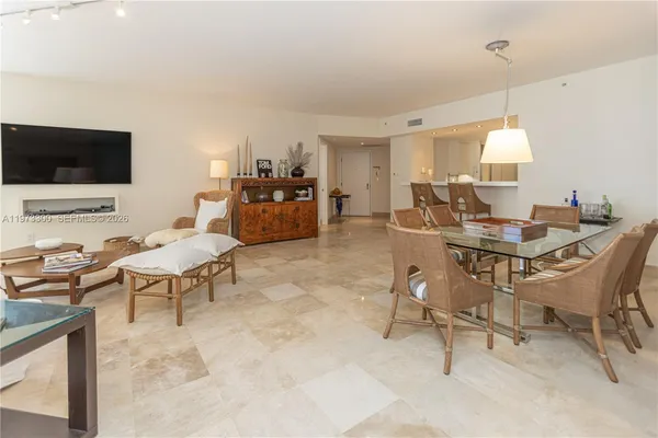 a kitchen with stainless steel appliances granite countertop a stove and white cabinets