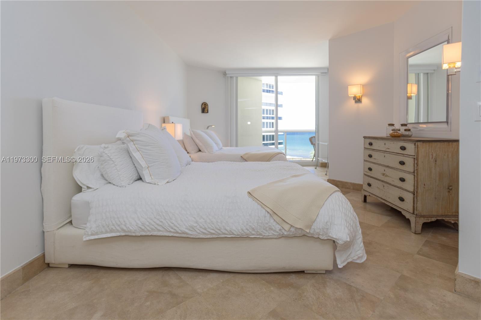 9559 Collins Avenue, Unit S7D Surfside, FL 33154 - Photo 32 of 59 a spacious bedroom with a bed and window