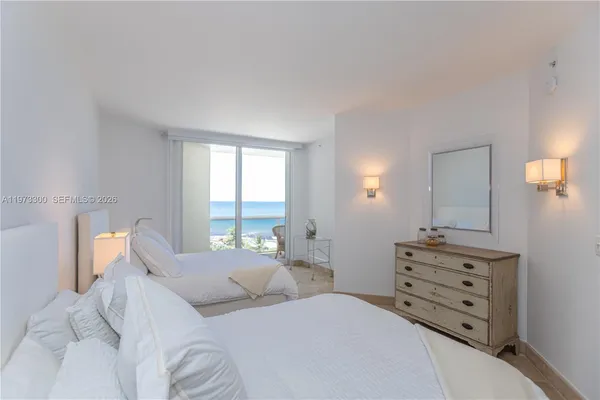 a bedroom with a bed and a television in it