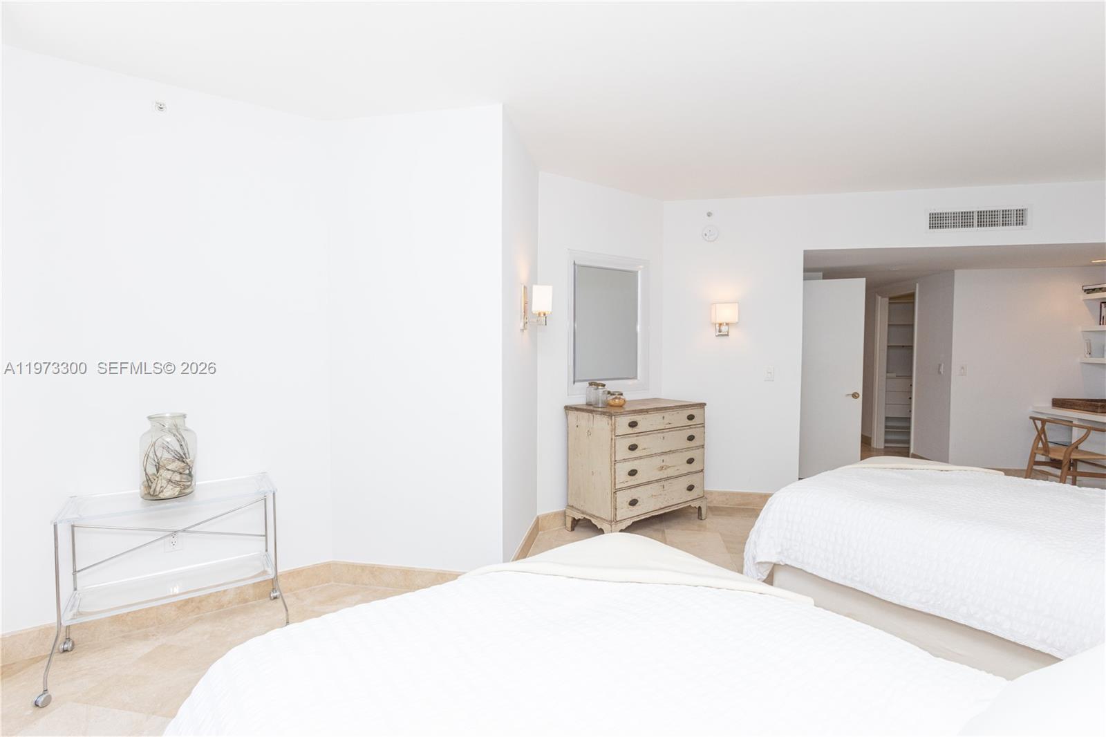 9559 Collins Avenue, Unit S7D Surfside, FL 33154 - Photo 34 of 59 a bedroom with a bed and wooden floor