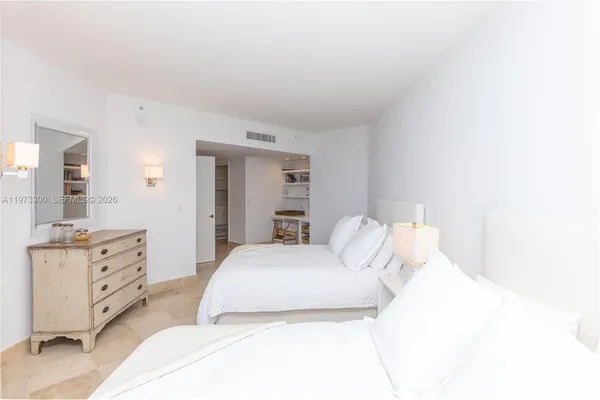 a spacious bathroom with a double vanity sink and a mirror