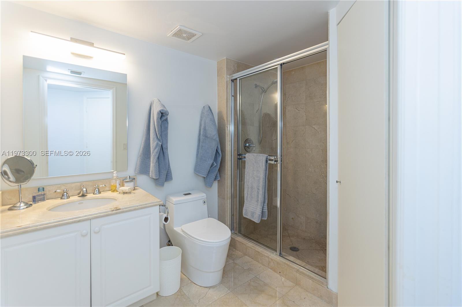 9559 Collins Avenue, Unit S7D Surfside, FL 33154 - Photo 49 of 59 a bathroom with a toilet sink and shower