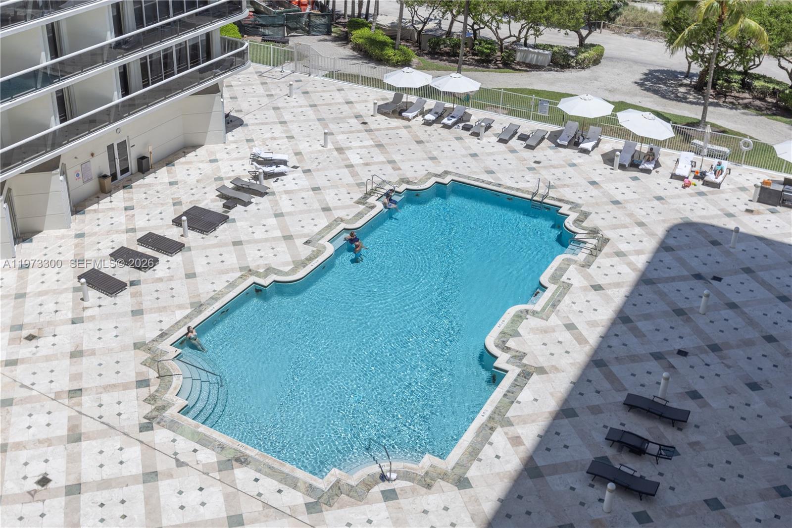 9559 Collins Avenue, Unit S7D Surfside, FL 33154 - Photo 54 of 59 a view of swimming pool with lounge chair