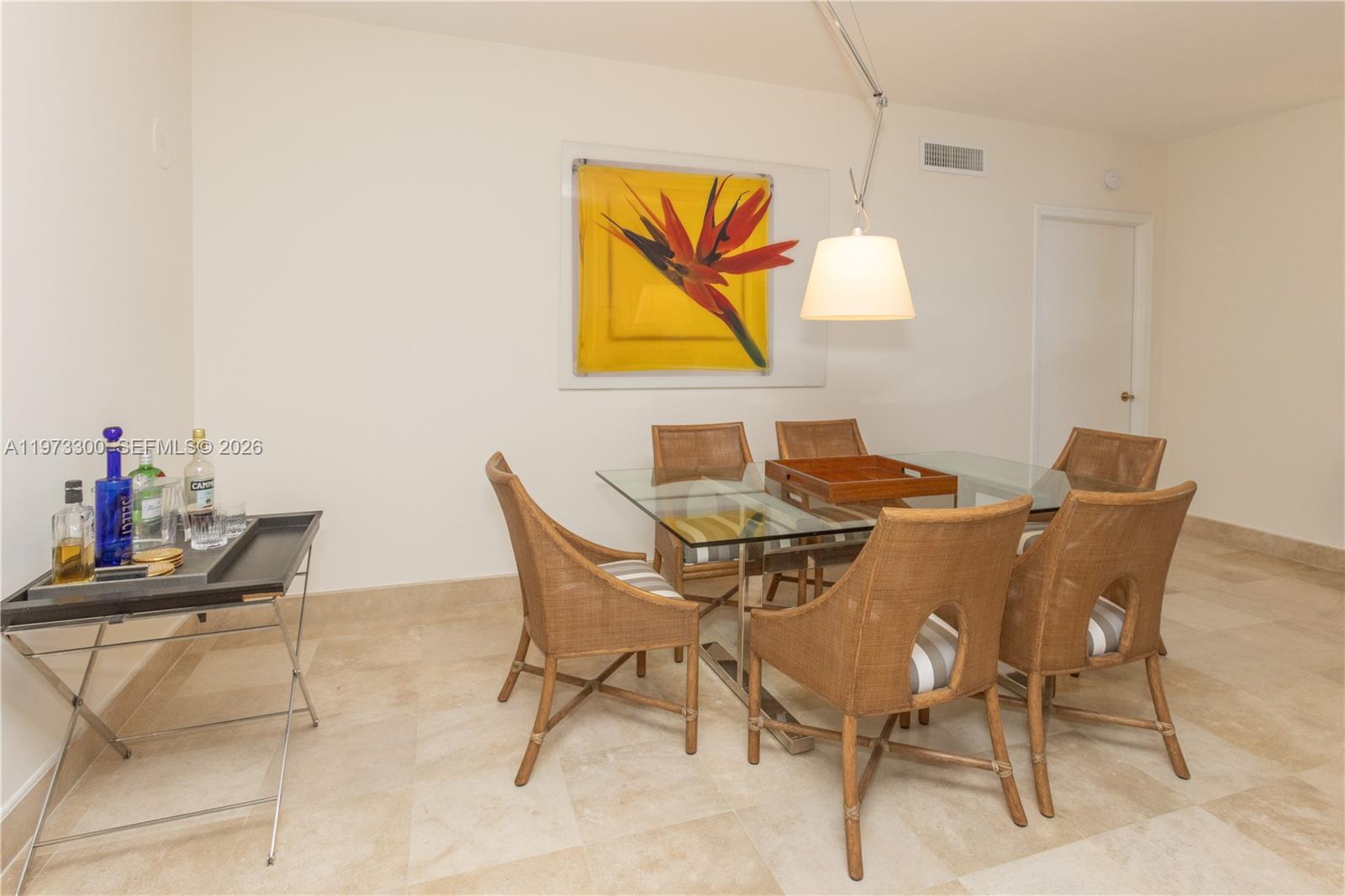9559 Collins Avenue, Unit S7D Surfside, FL 33154 - Photo 8 of 59 a view of a dining room with furniture and wooden floor
