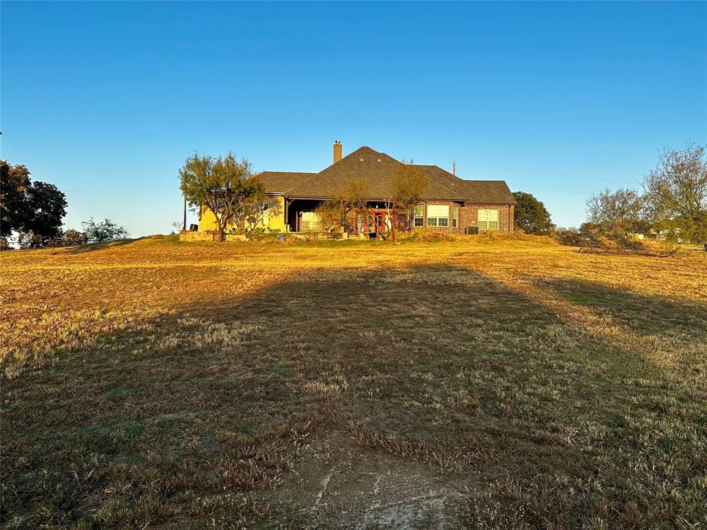 107 Rock Salt Court Springtown, TX 76082 - Photo 15 of 22 a view of a house with a yard