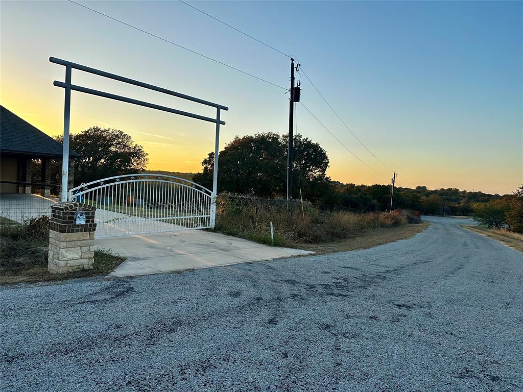 107 Rock Salt Court Springtown, TX 76082 - Photo 18 of 22 a backyard of a house with table and chairs