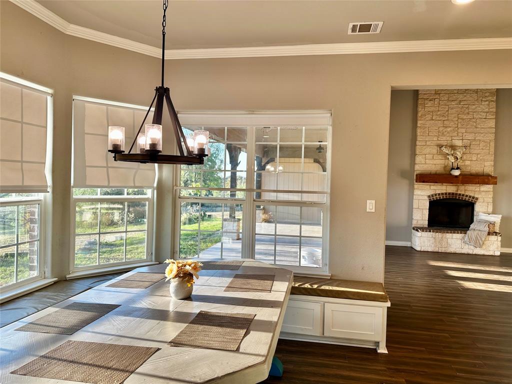 107 Rock Salt Court Springtown, TX 76082 - Photo 7 of 22 a dining room with a table and chairs
