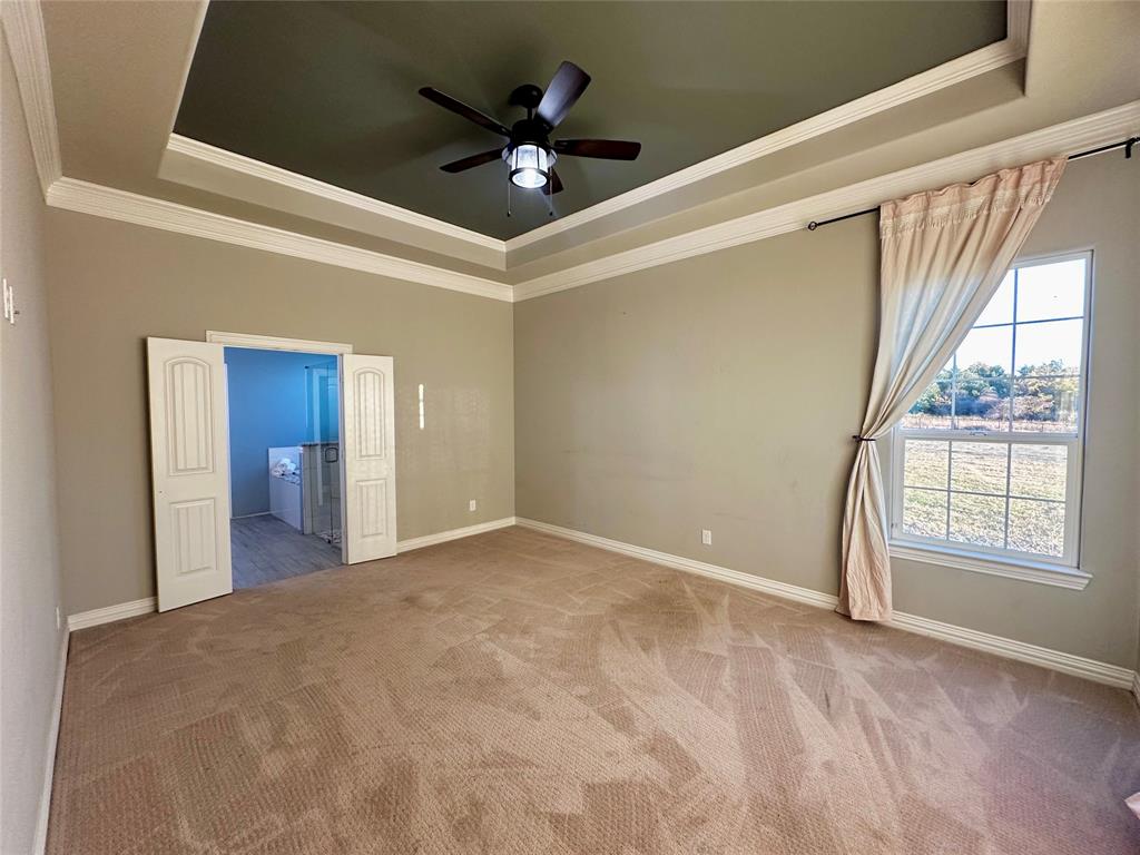 107 Rock Salt Court Springtown, TX 76082 - Photo 10 of 22 a view of an empty room with a window