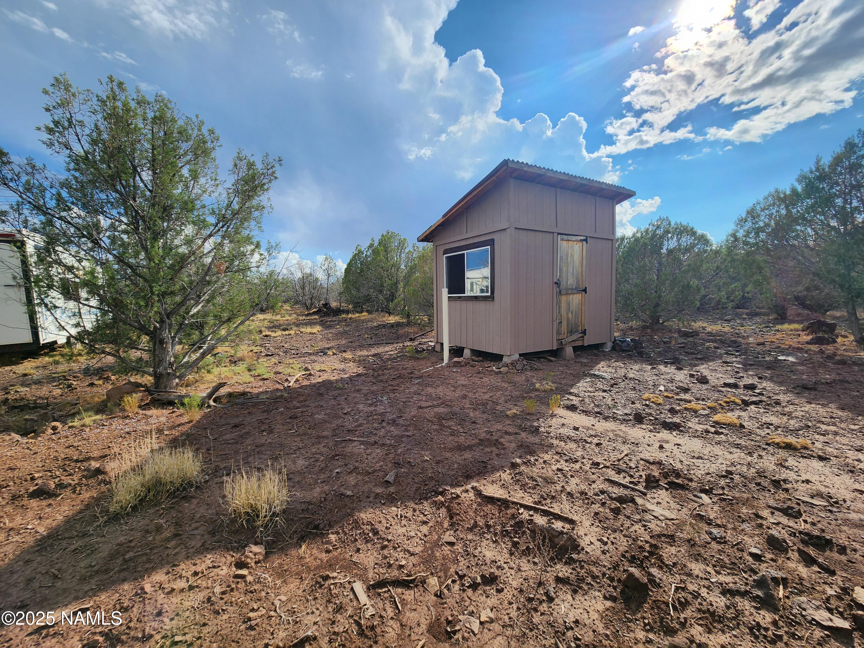 147 Camp Road Ash Fork, AZ 86320 - Photo 2 of 3 a view of a house with a yard