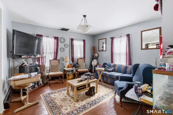 a living room with furniture and a flat screen tv