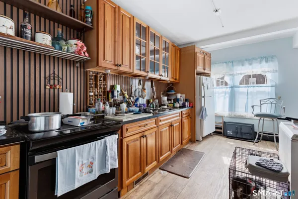a kitchen with stainless steel appliances a sink and cabinets