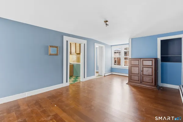 a view of a livingroom with furniture and wooden floor