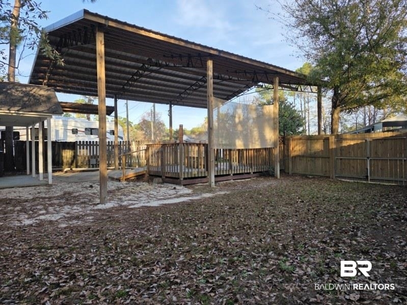 182 Defuniak Loop Lillian, AL 36549 - Photo 6 of 21 View of parking featuring a fenced backyard