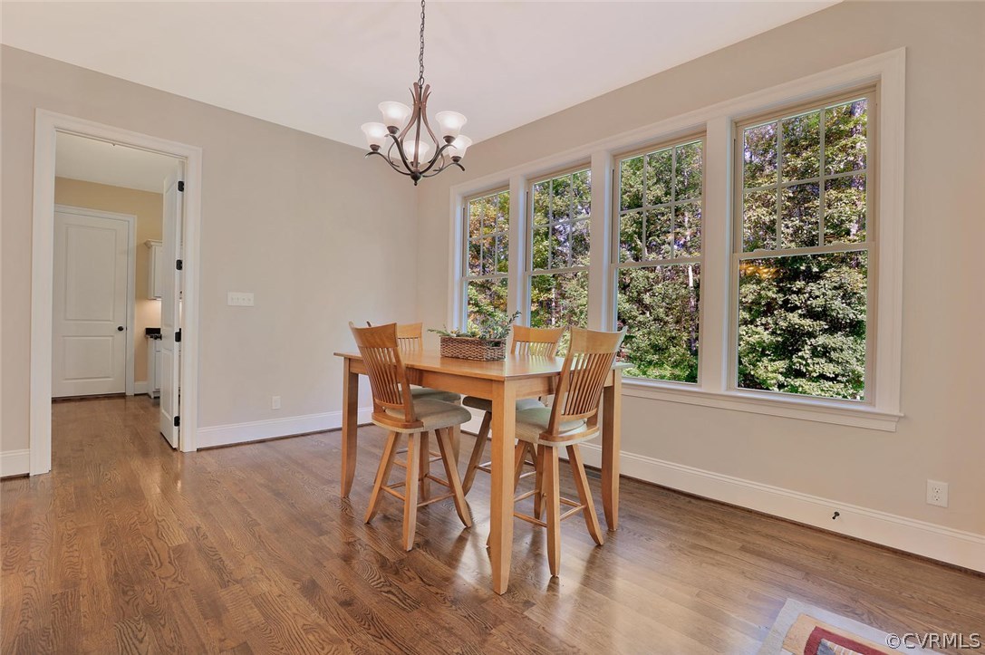 16106 Alsdell Road Midlothian, VA 23112 - Photo 16 of 46 a view of a dining room with furniture window and wooden floor
