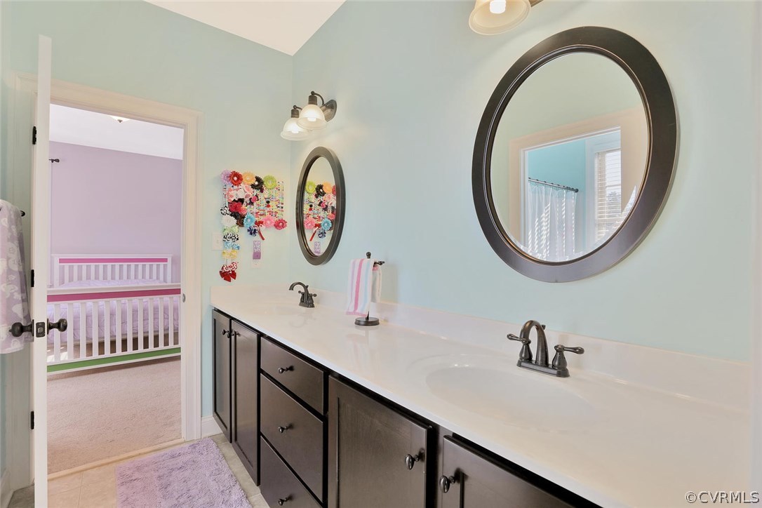 16106 Alsdell Road Midlothian, VA 23112 - Photo 25 of 46 a bathroom with a sink and a mirror