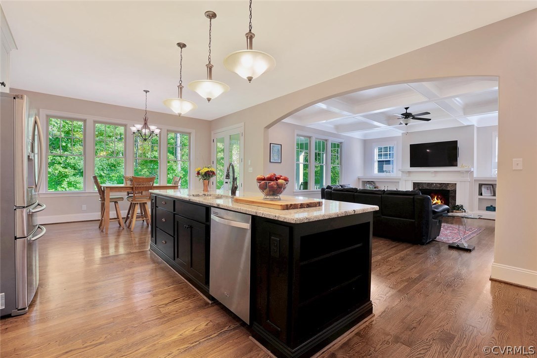 16106 Alsdell Road Midlothian, VA 23112 - Photo 3 of 46 a kitchen with kitchen island a sink stove and wooden floor