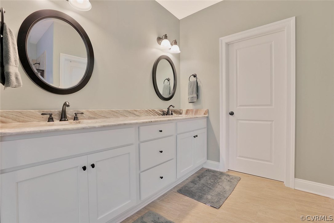 16106 Alsdell Road Midlothian, VA 23112 - Photo 31 of 46 a bathroom with a granite countertop double vanity sink and a mirror