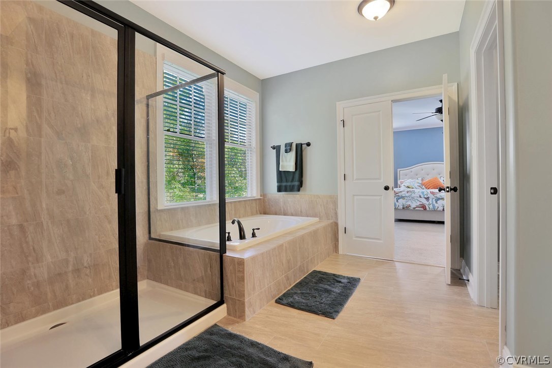 16106 Alsdell Road Midlothian, VA 23112 - Photo 32 of 46 a spacious bathroom with a tub mirror and window