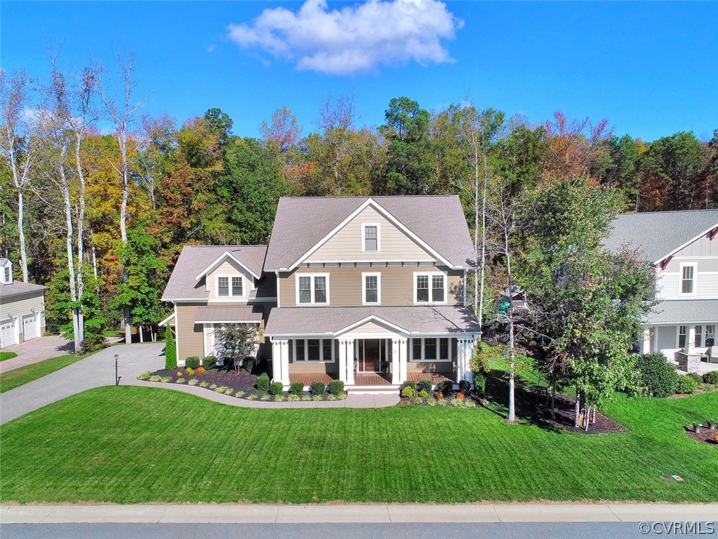 16106 Alsdell Road Midlothian, VA 23112 - Photo 41 of 46 a front view of a house with a garden and trees