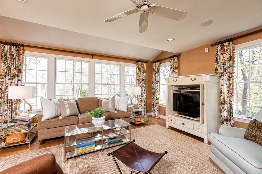 44 Eaton Road Lexington, MA 02420 - Photo 11 of 24 a living room with furniture large window and a fireplace
