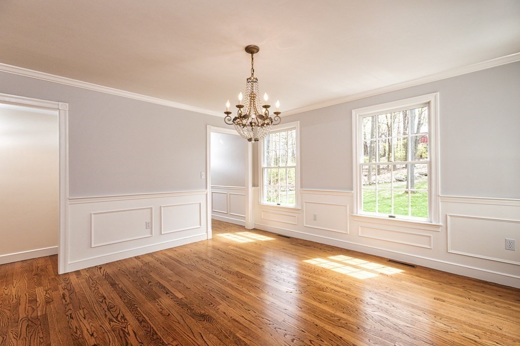 44 Eaton Road Lexington, MA 02420 - Photo 12 of 24 a view of an empty room with wooden floor and a window