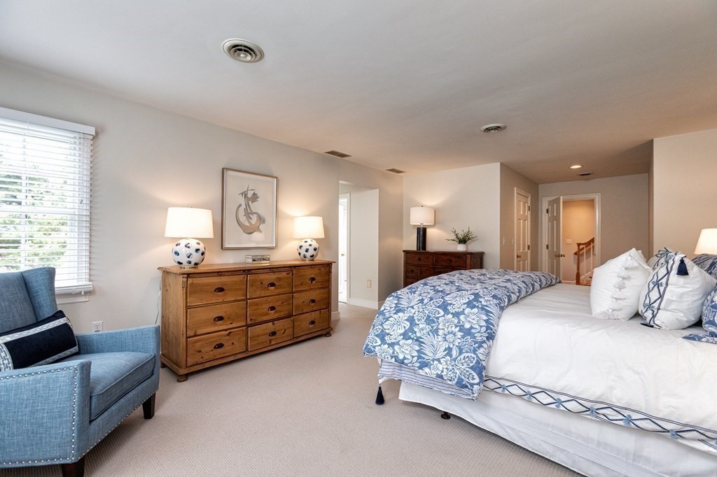 44 Eaton Road Lexington, MA 02420 - Photo 14 of 24 a bedroom with a bed and furniture