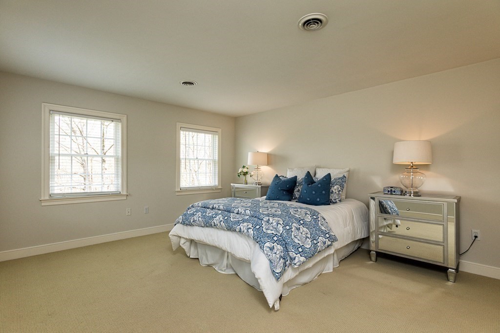 44 Eaton Road Lexington, MA 02420 - Photo 17 of 24 a bedroom with a bed and a window