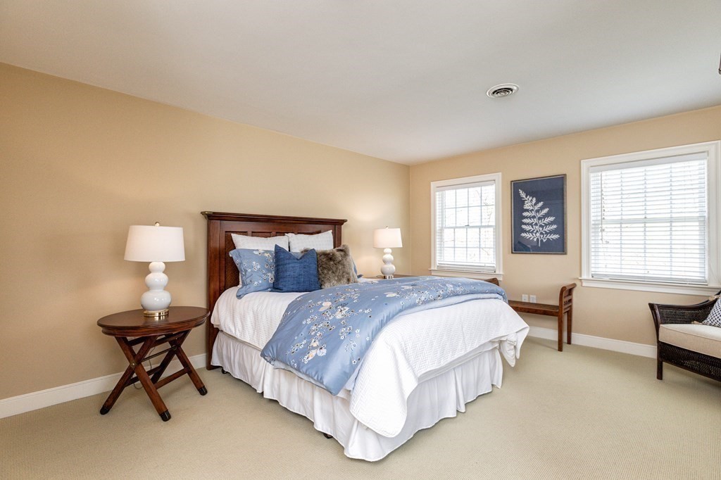 44 Eaton Road Lexington, MA 02420 - Photo 18 of 24 a spacious bedroom with a bed and a couch