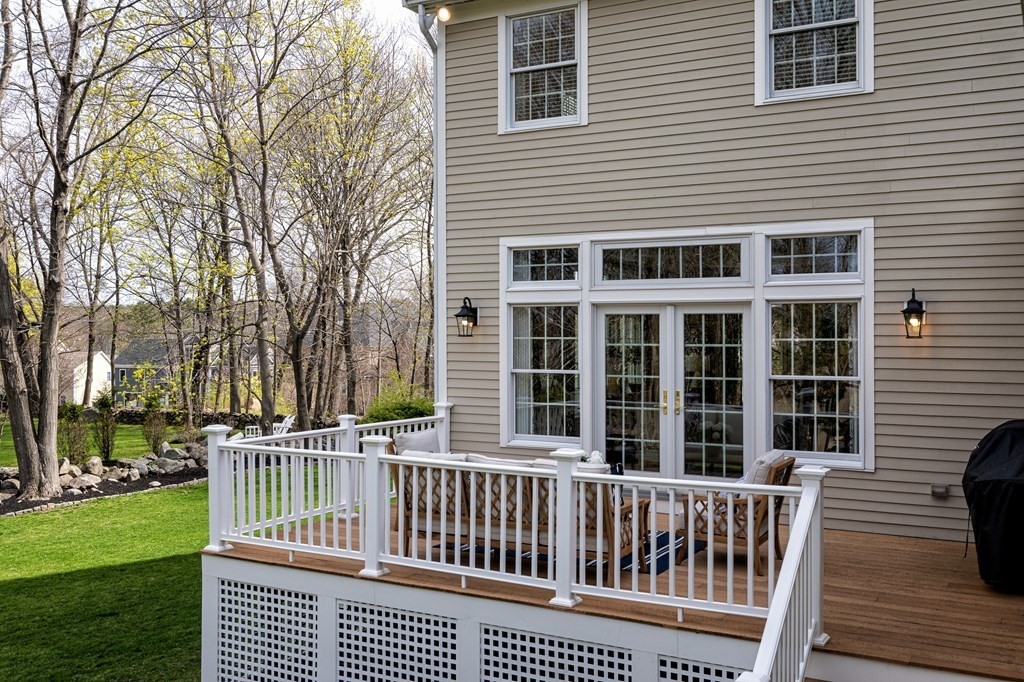 44 Eaton Road Lexington, MA 02420 - Photo 23 of 24 a view of a deck with a yard