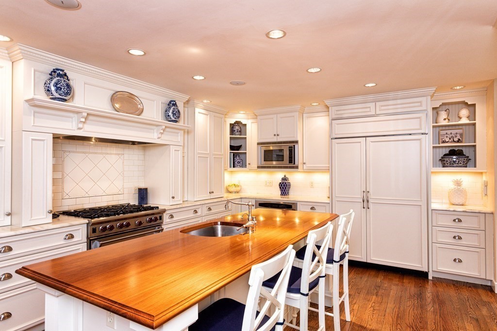 44 Eaton Road Lexington, MA 02420 - Photo 4 of 24 a kitchen with stainless steel appliances granite countertop a sink a stove and a refrigerator